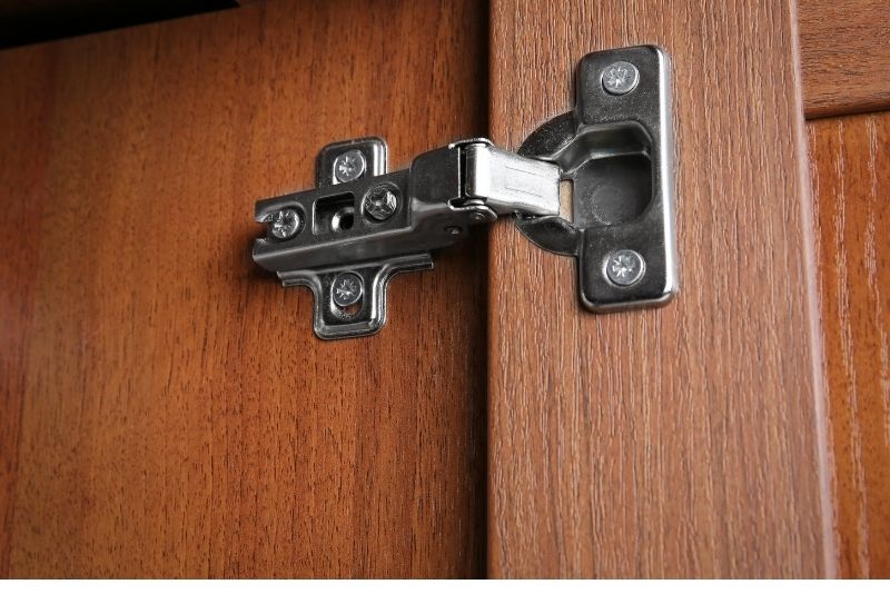 A hinge used on a hinged- door wardrobe